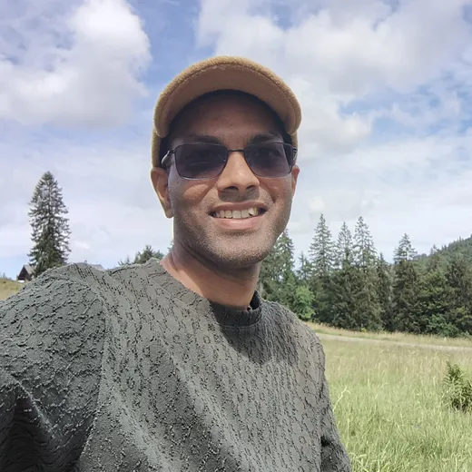 Nitin, English teacher at Crefolo, smiling at the camera